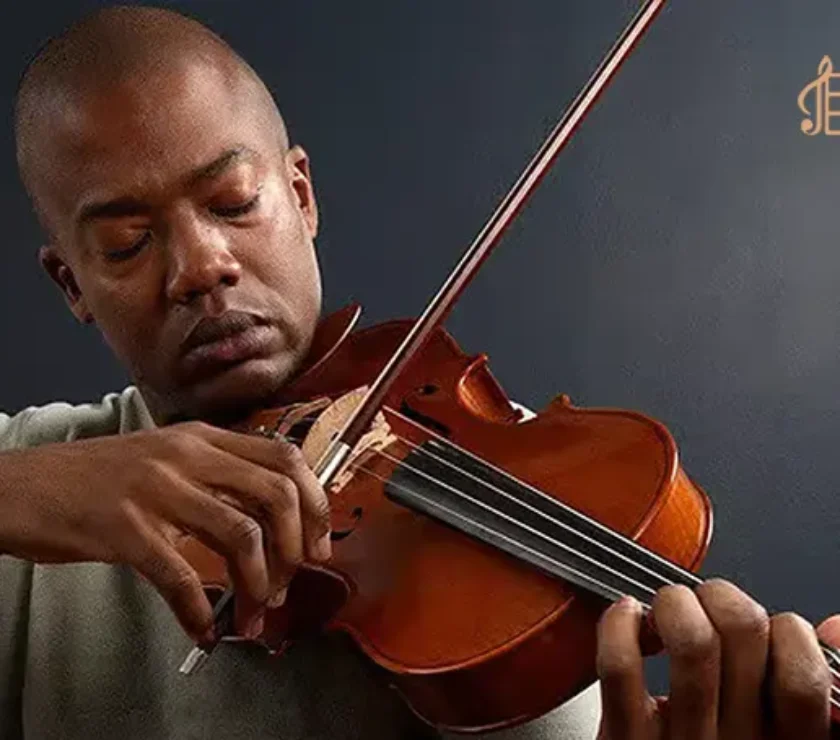a man playing violon with eyes closed