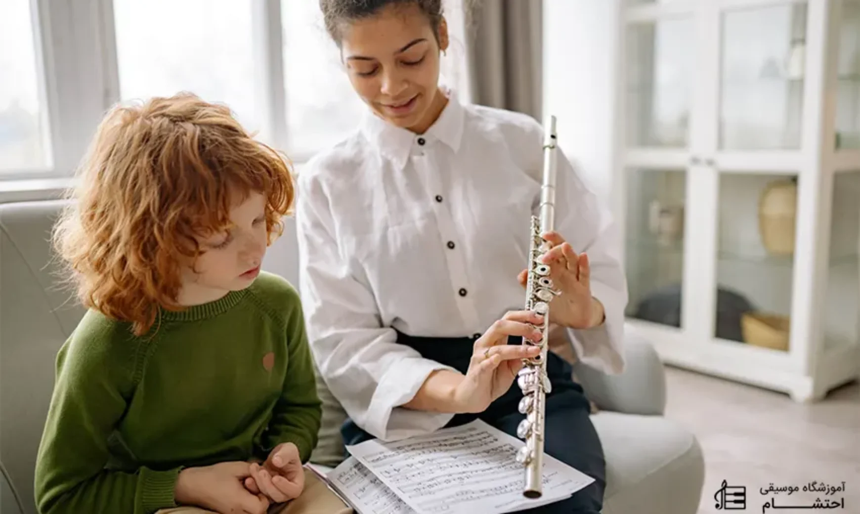 a women teaching flute to a kid