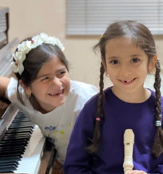 two children are smiling
