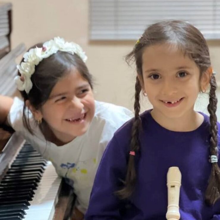 two children are smiling
