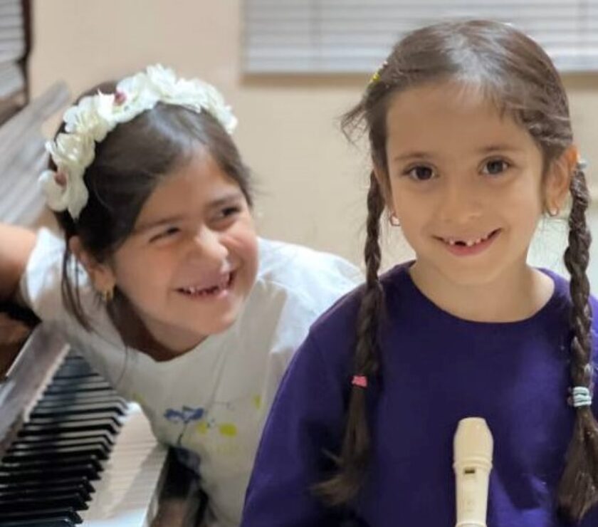two children are smiling